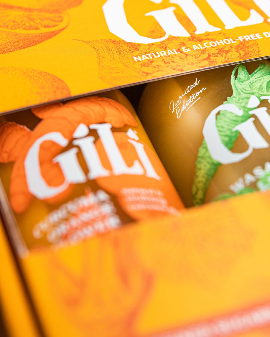 a close shot of the a bottle of gili in its box