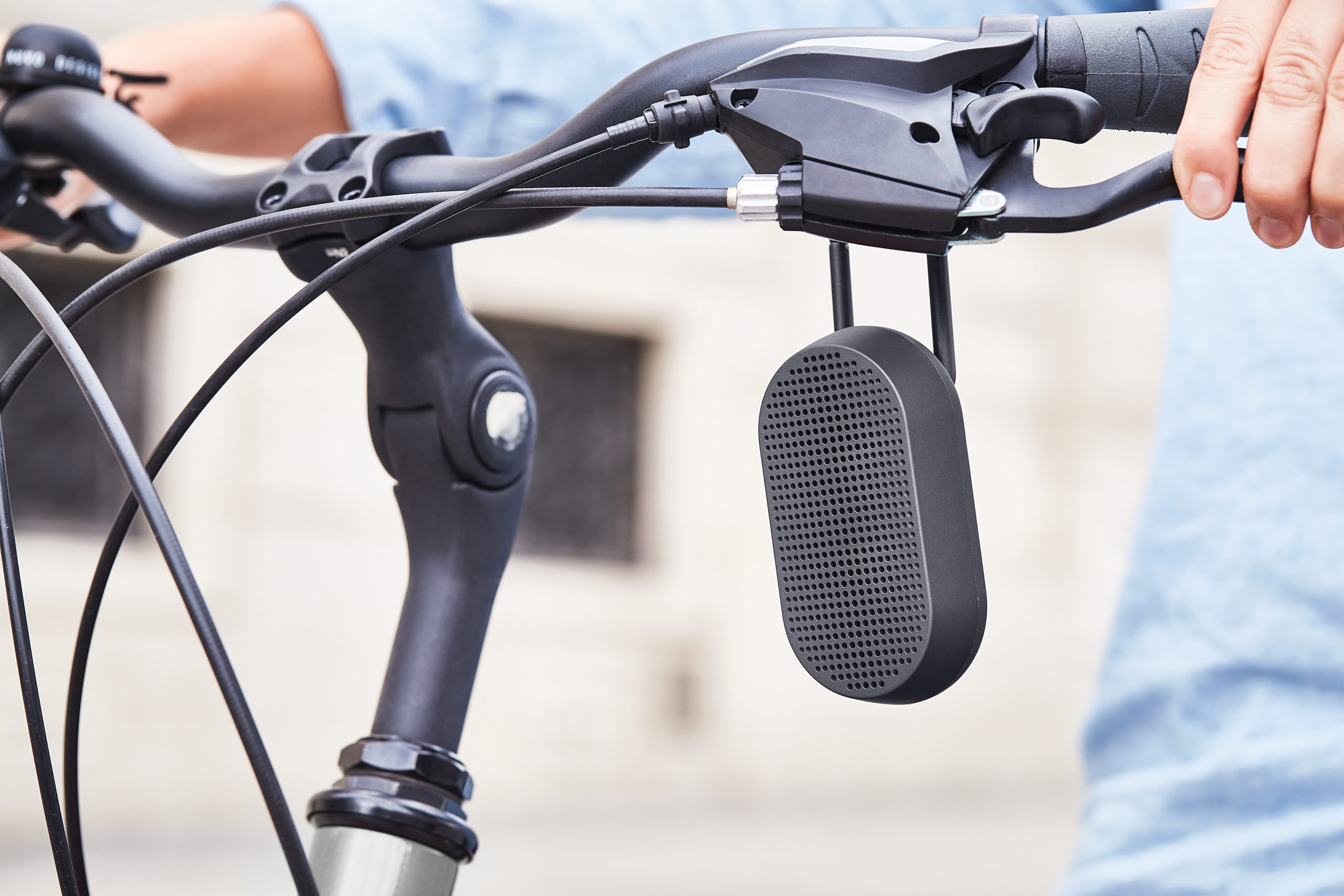 black outside bluetooth speaker attached to a bike