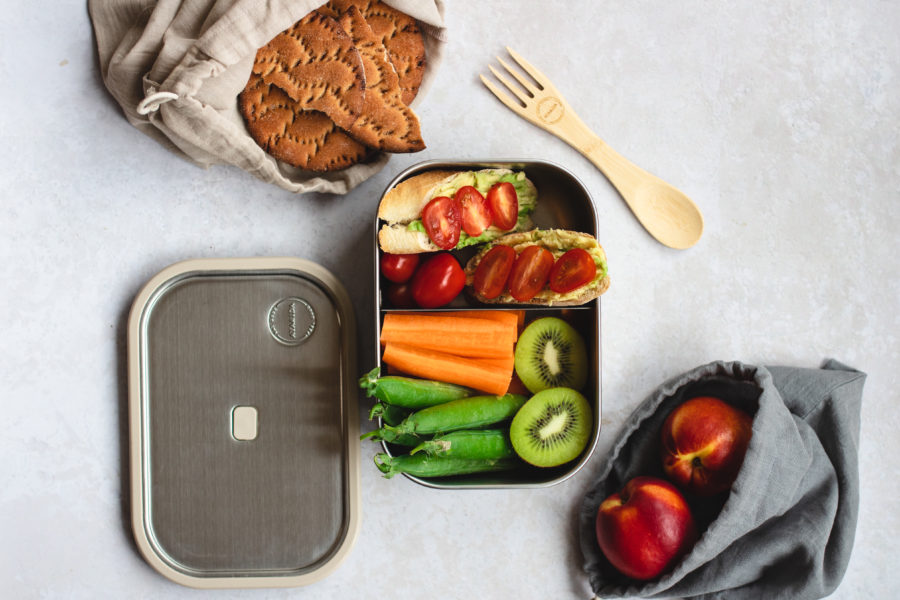 Colored lunch box with food in it