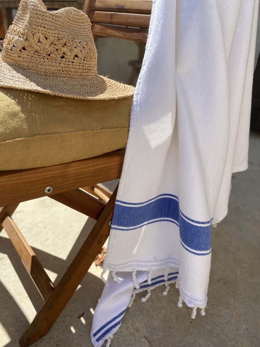 white and blue fouta on a chair