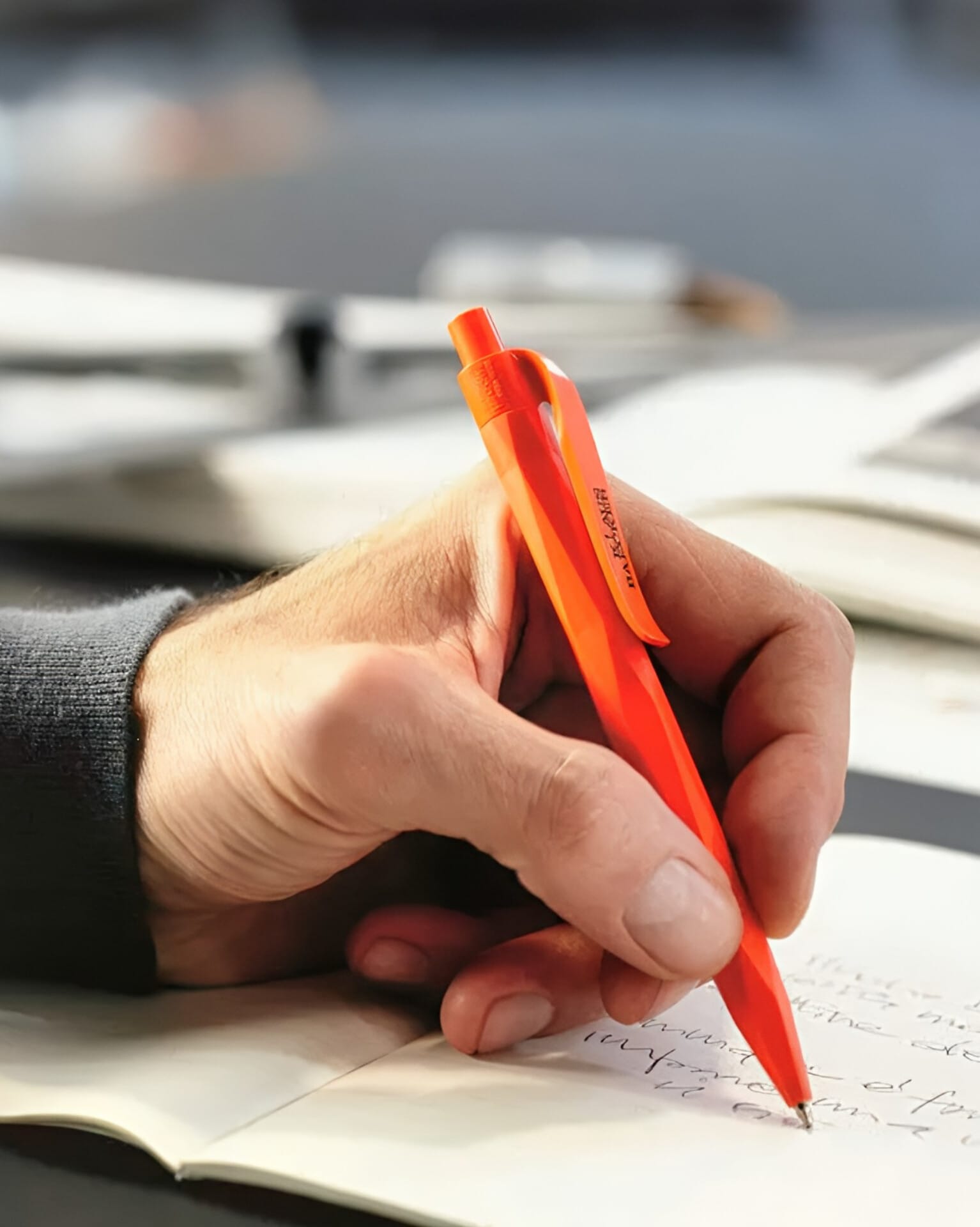 someone writing with a Prodir pen